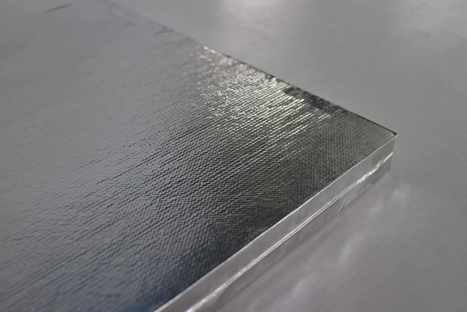 Microporous Board — a corner of the foil-faced board, showing the embossed foil and the wrapped edge